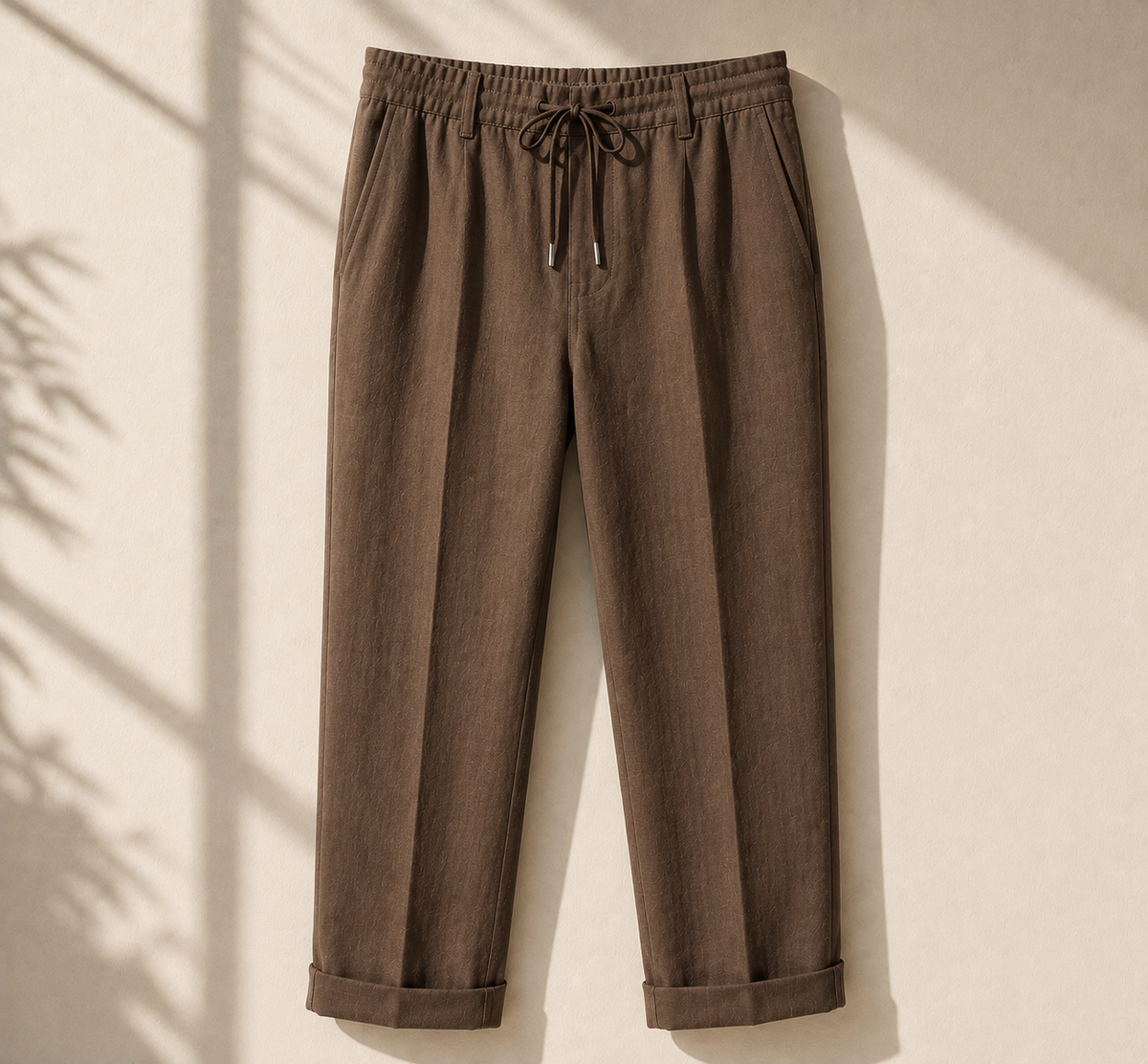 Men's brown linen drawstring pants relaxed fit on neutral background - Rivaro