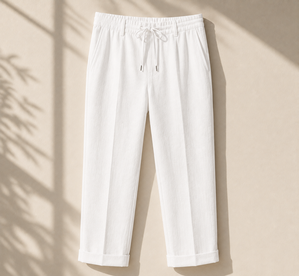 Men's white linen drawstring pants relaxed fit on neutral background - Rivaro